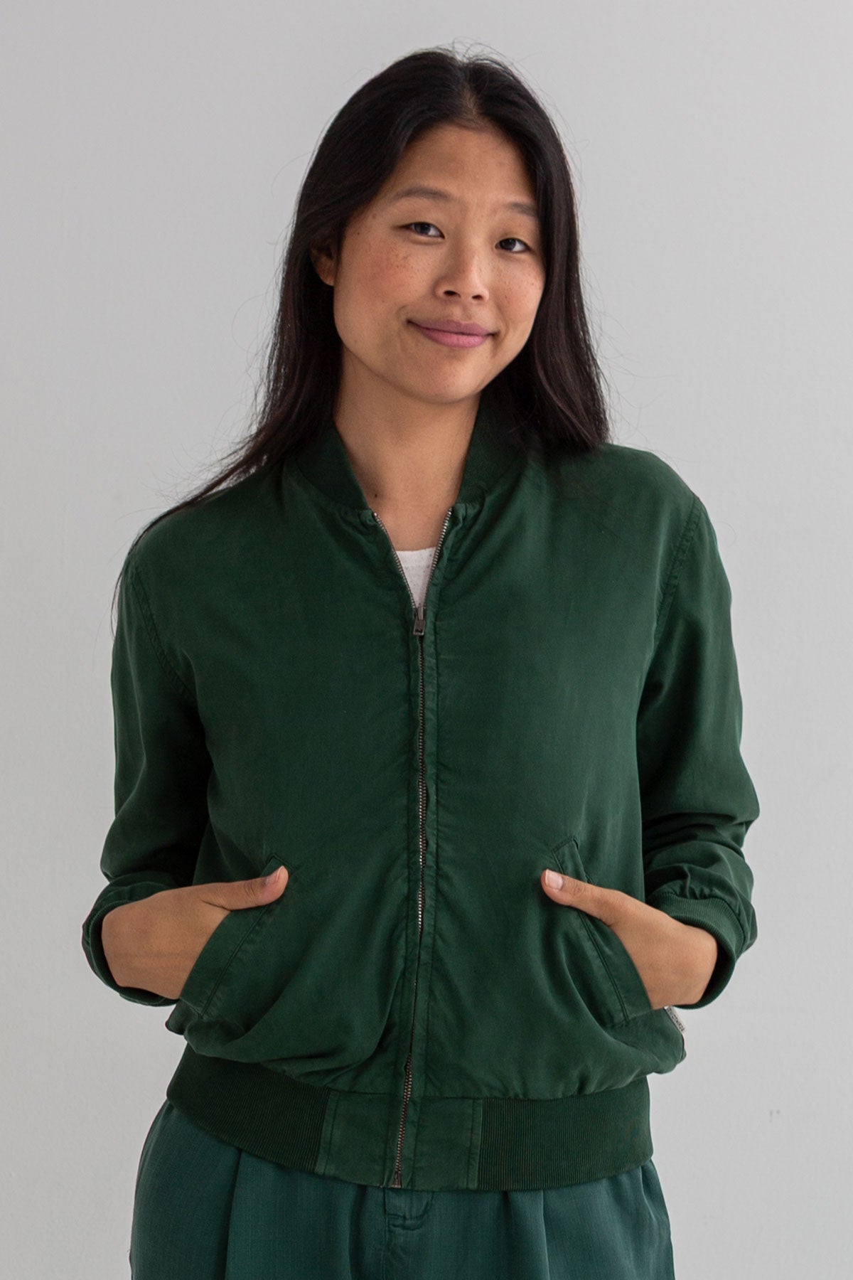 Dark green bomber jacket women wear view front