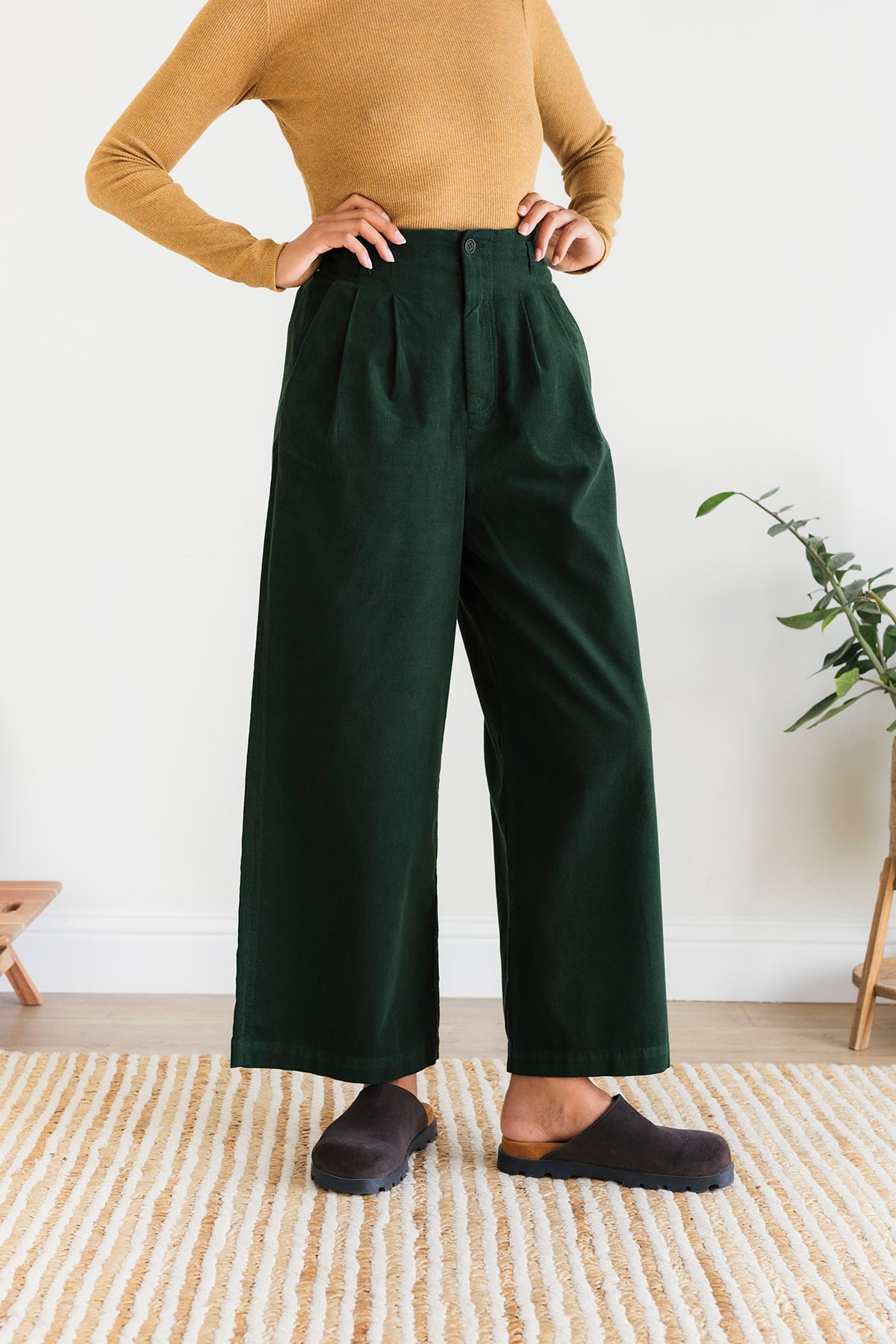 meta-preview, high-waisted green corduroy trousers