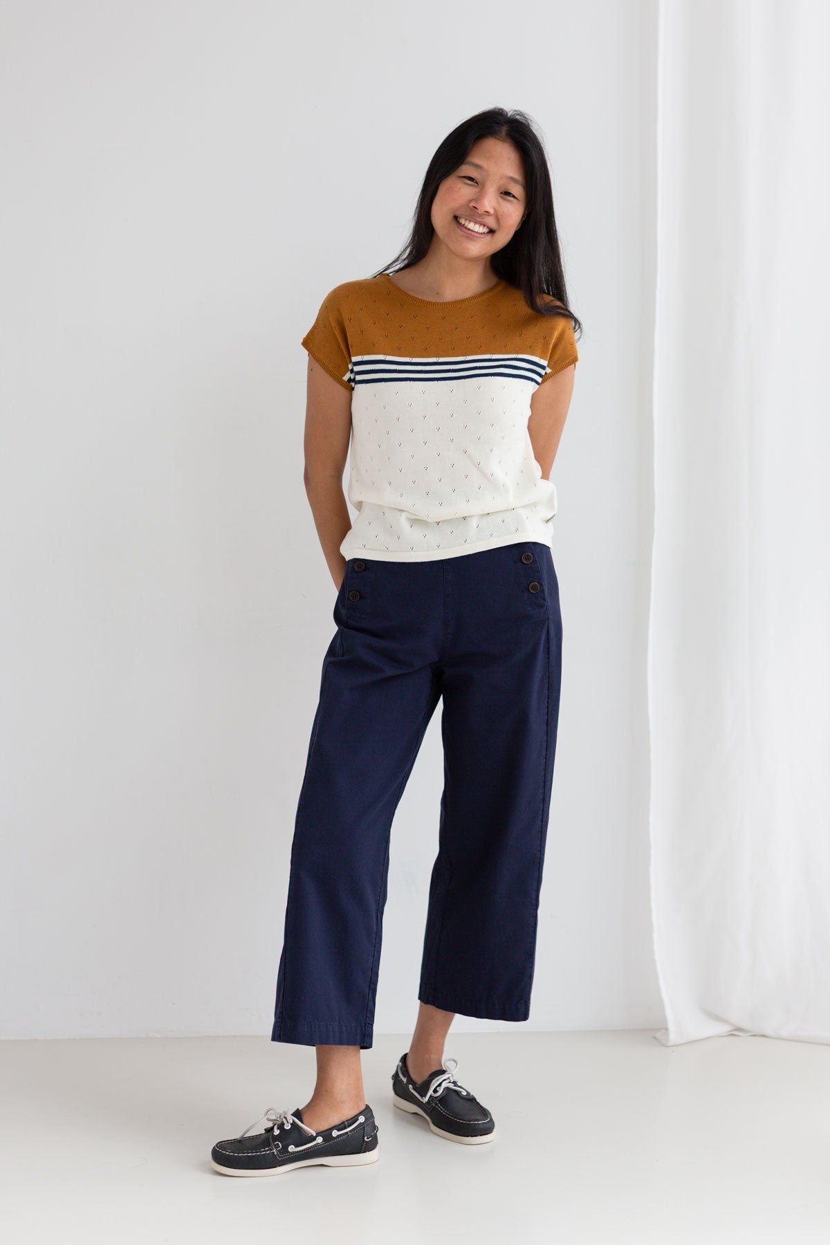 Ecru mustard knit top women navy pants full body view