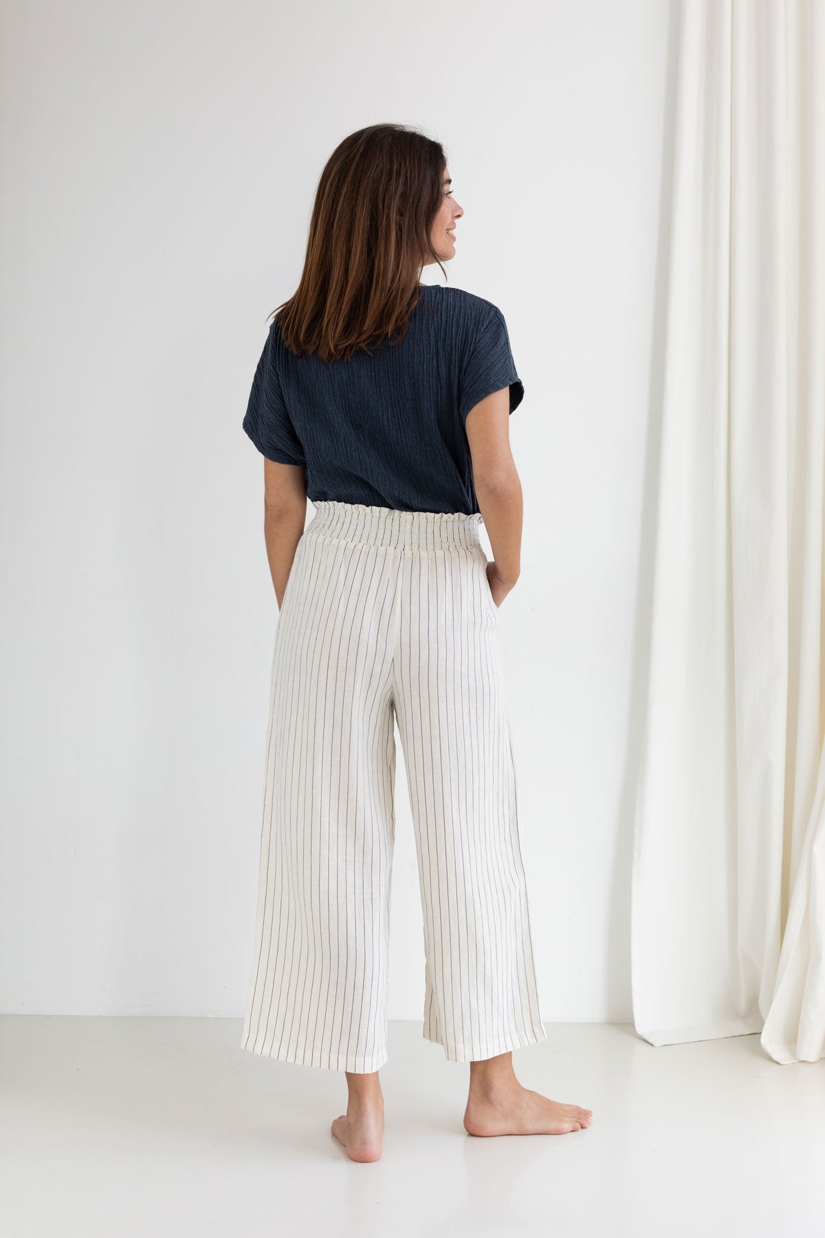 Dusty blue Bambula shirt women striped pants full body view back