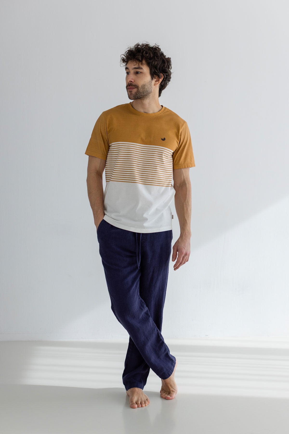 Mustard Colour-block t-shirt men navy pants full body view front