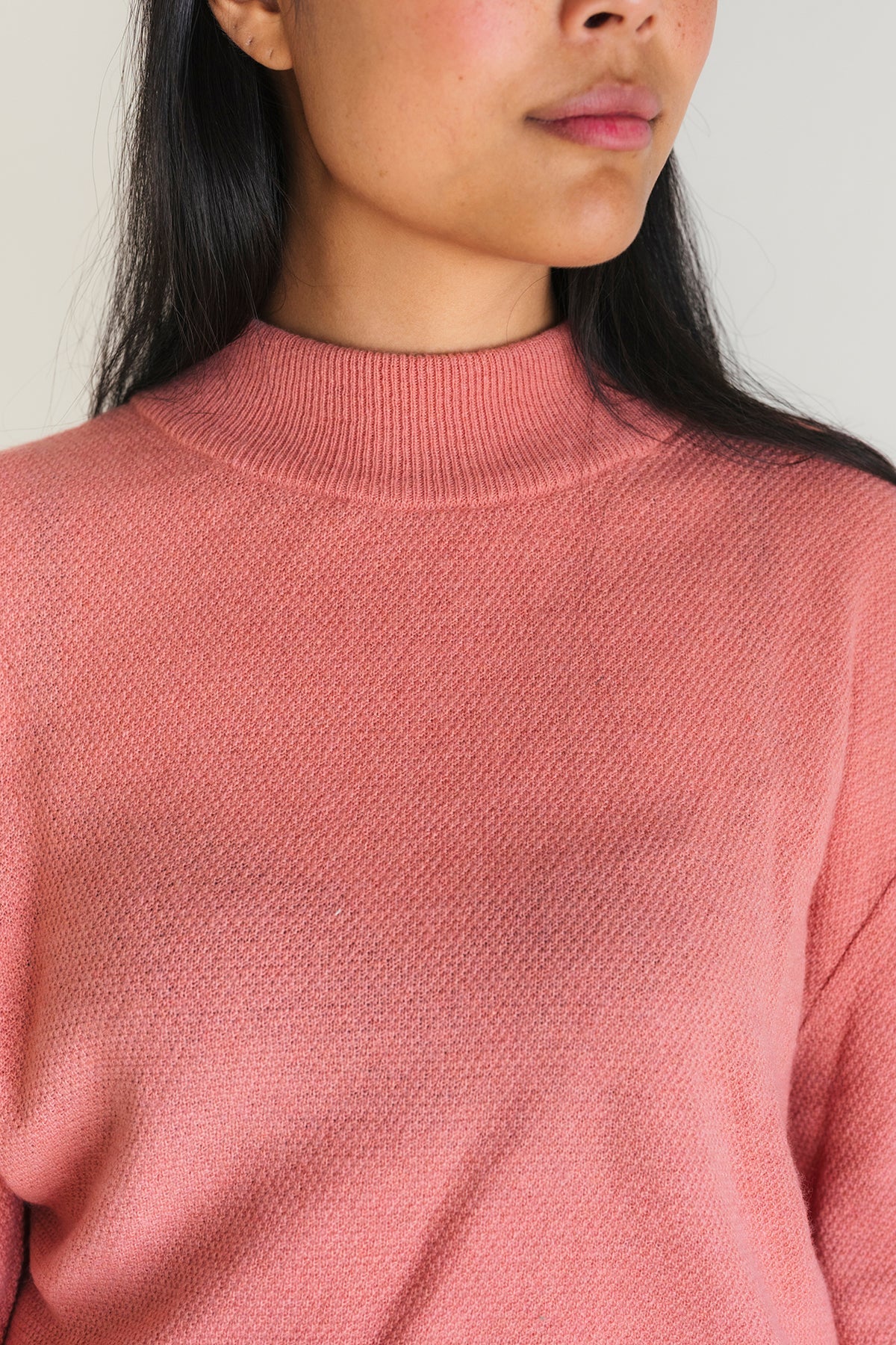 meta-hover, high ribbed neckline on pink knit