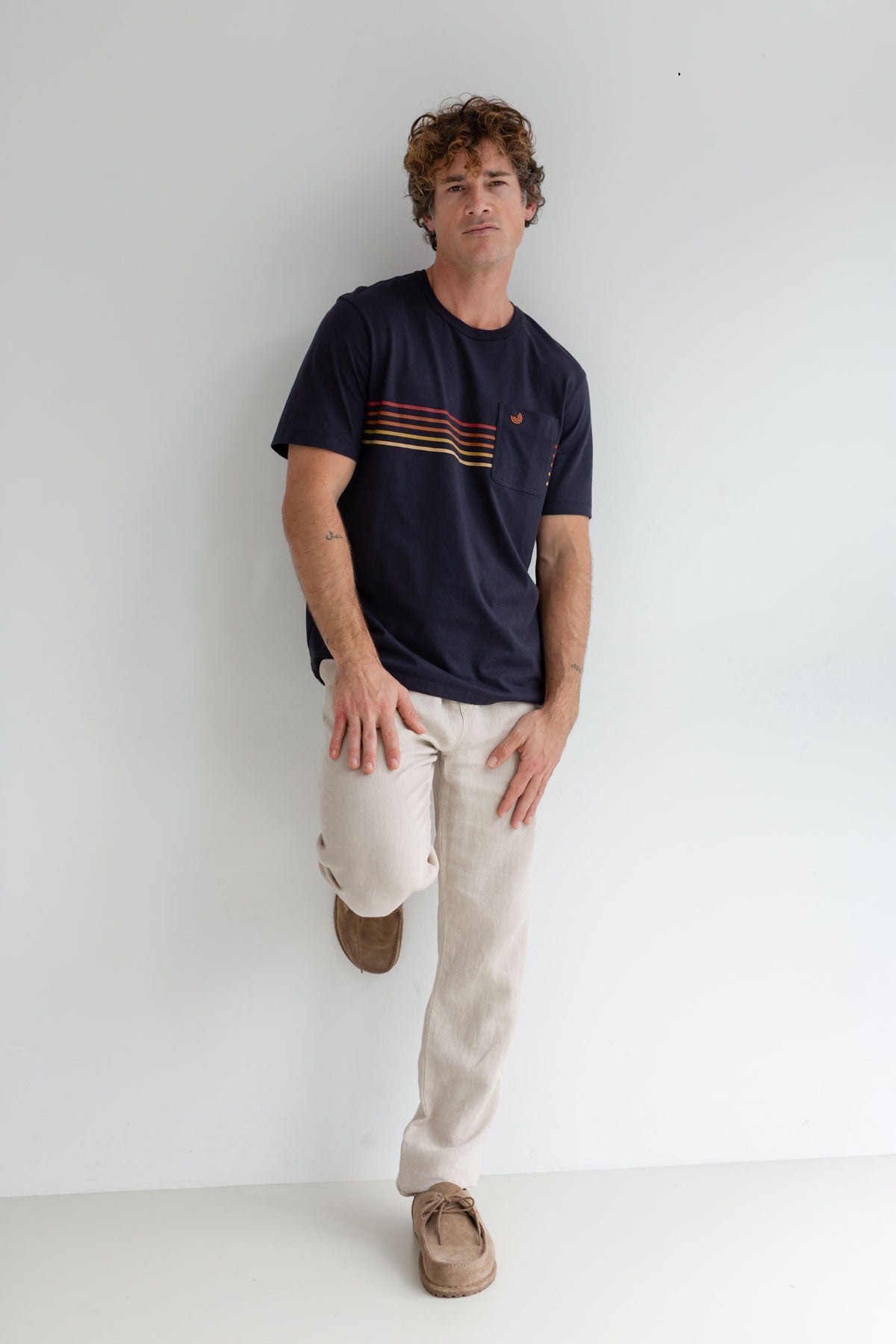 Navy roundneck tshirt men light pants full body view front 
