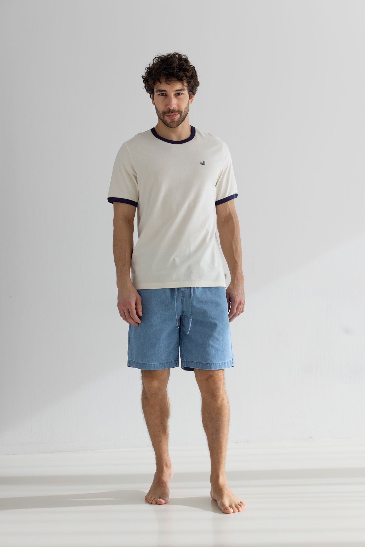 White blue tshirt men denim shorts full body view front 