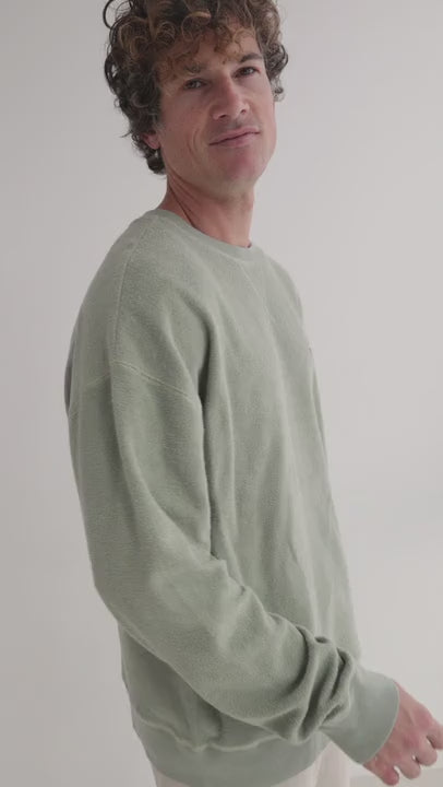 Light green sweatshirt men white pants 