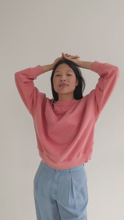 Pink American fleece sweatshirt women light blue pants full body view 