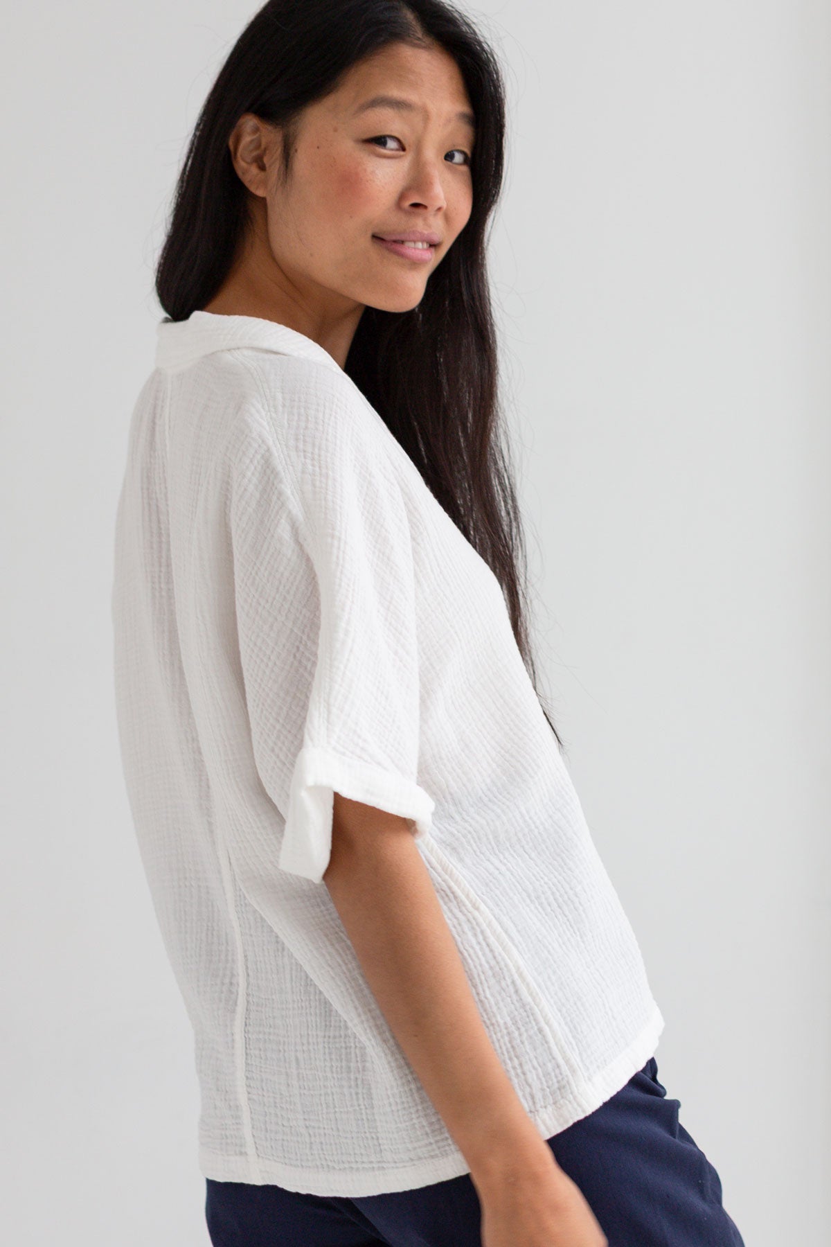 Off white muslin shirt women navy pants wear view side
